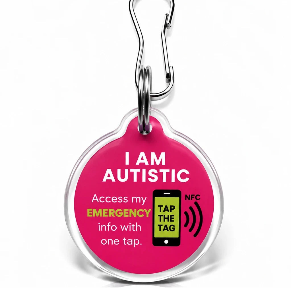 Pink I Am Autistic NFC tag keyring. Tap with a smartphone to see communication needs and emergency contacts, no app needed